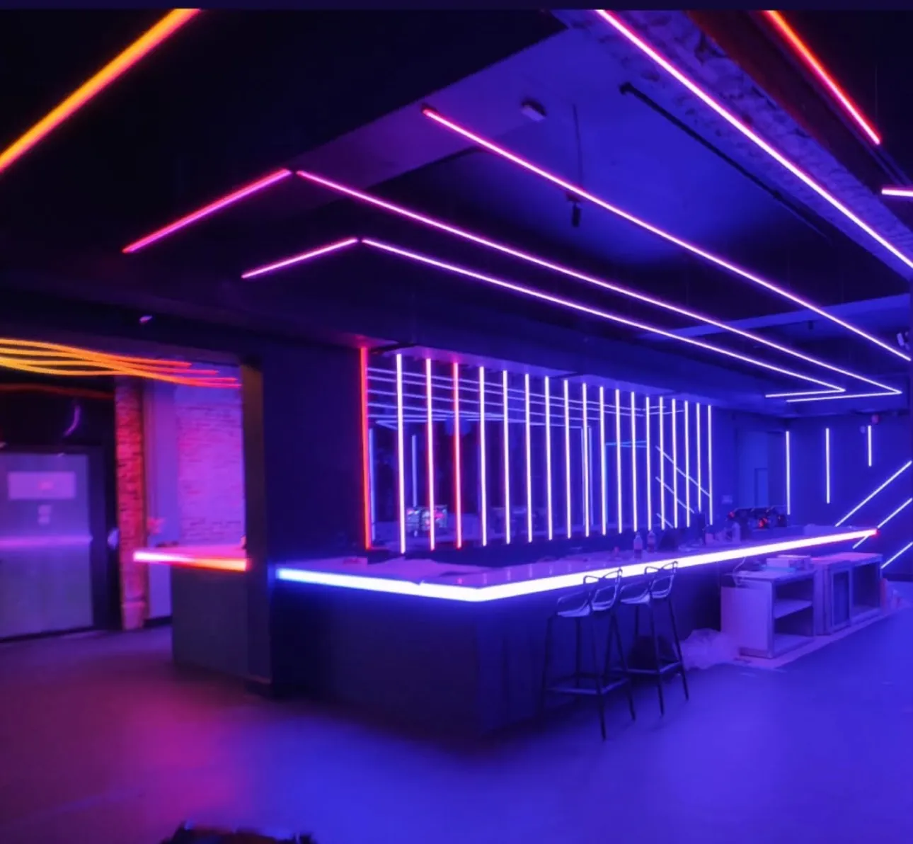 Anthem Orlando: finished bar with purple and pink neon line lighting.