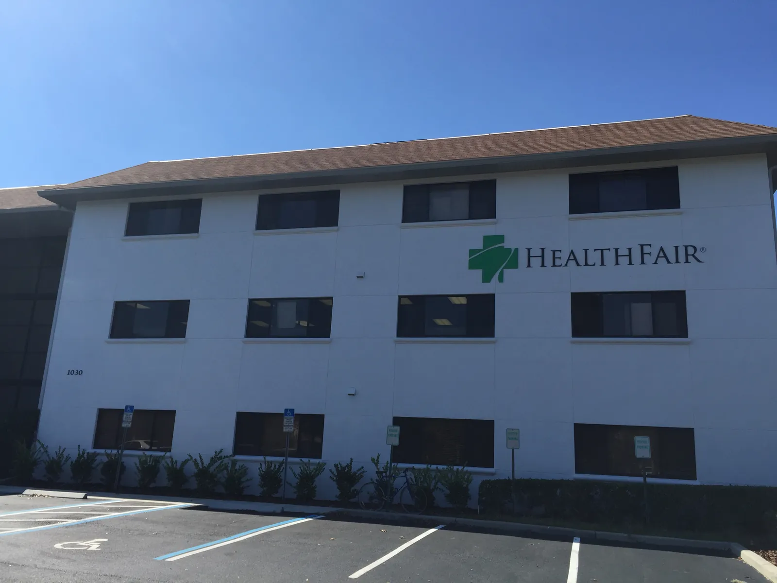 A three-storey office building with HealthFair signage, from the Benchmark Building Group portfolio.